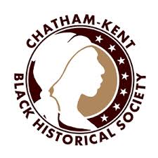 The logo of the Chatham-Kent Black Historical Society. The name appears around a circle with stars arranged on the right interior and the profile silhouette of a Black woman on the right