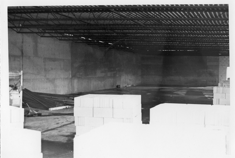 An image of the Museum of Ontario Archaeology's gallery under construction. bare concrete walls and the metal ceiling are visible.