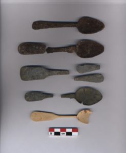 Nine spoon artifacts shown as possible reconstructions. A scale bar is shown underneath.