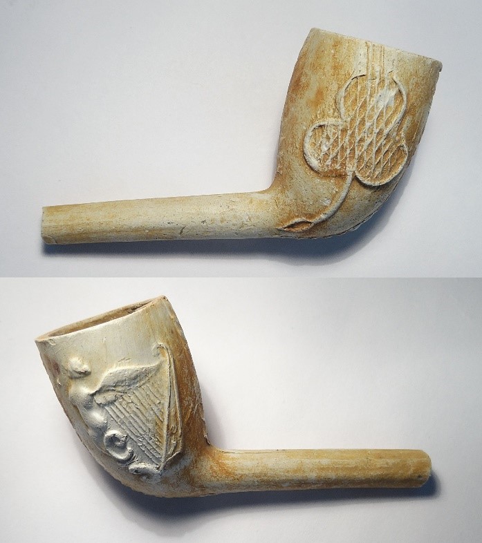 Irish white clay pipe with a harp on one side and a shamrock on the other